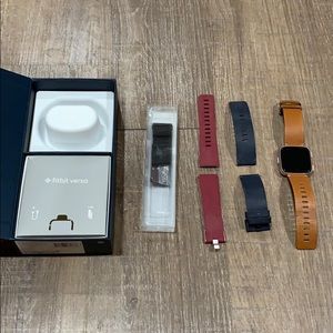 fitbit versa (rose gold) with 4 bands